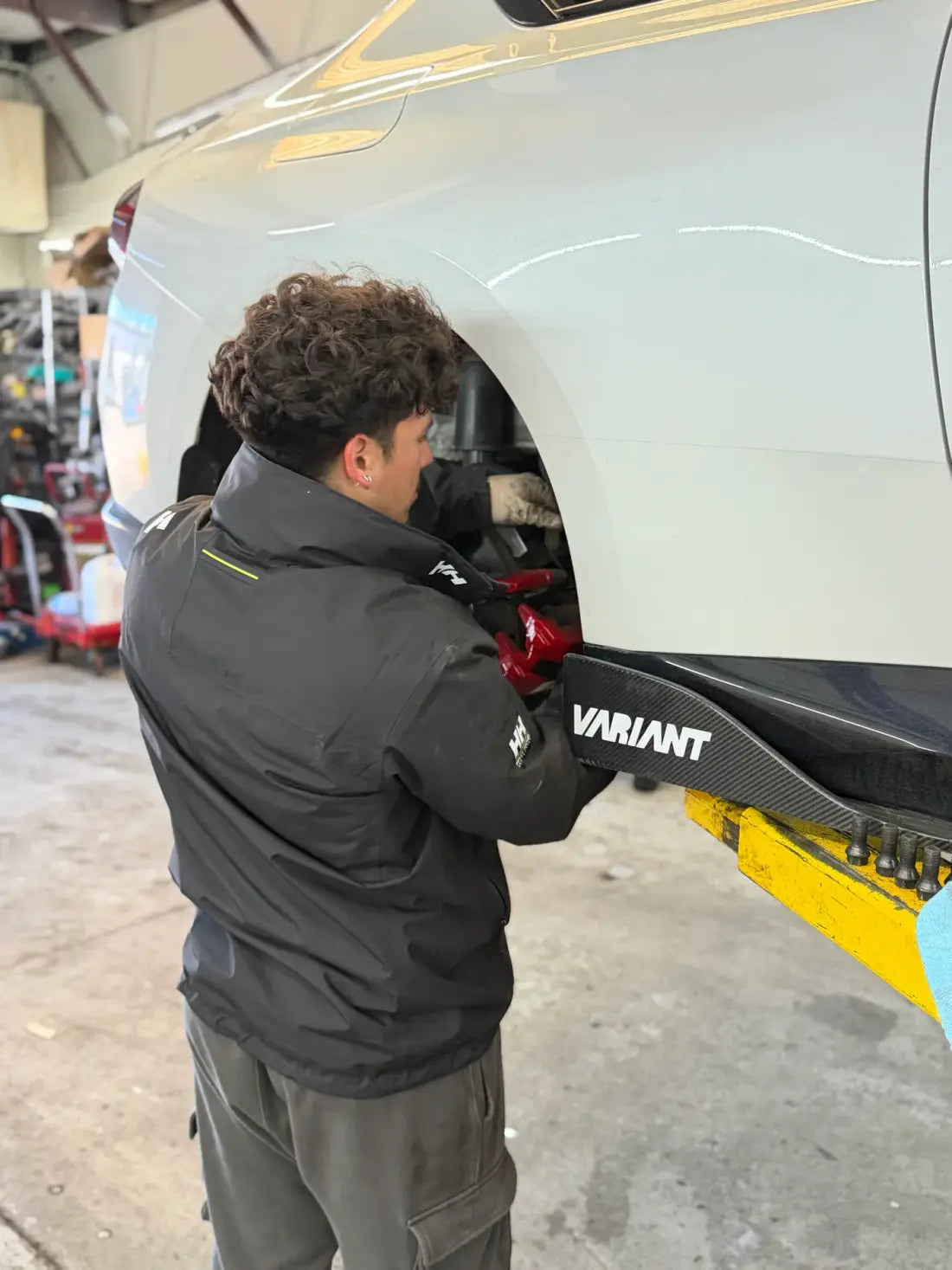 AYRD technician working on a performance vehicle’s brakes